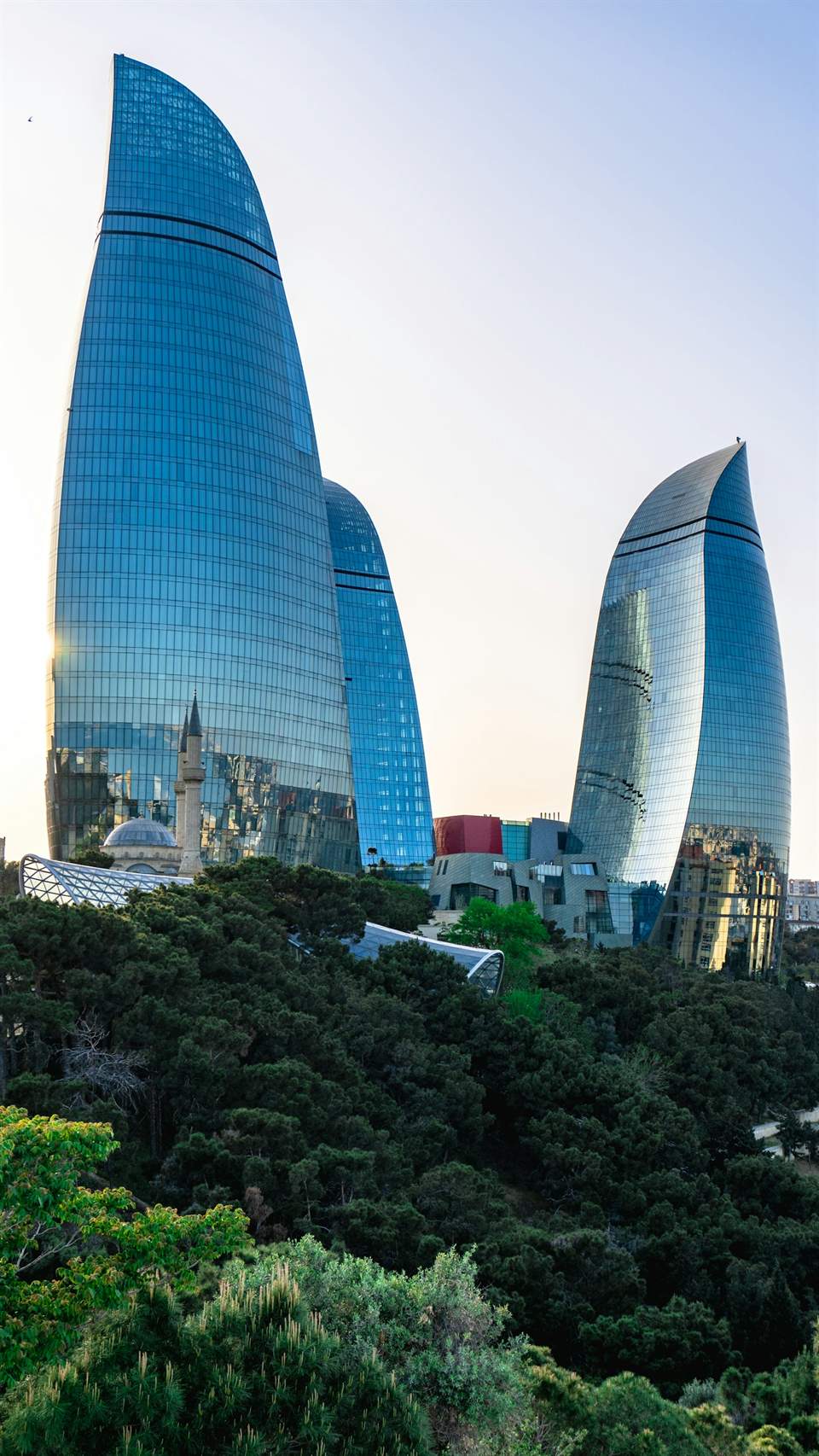 Flame Towers rising above Baku, cinematic dusk light