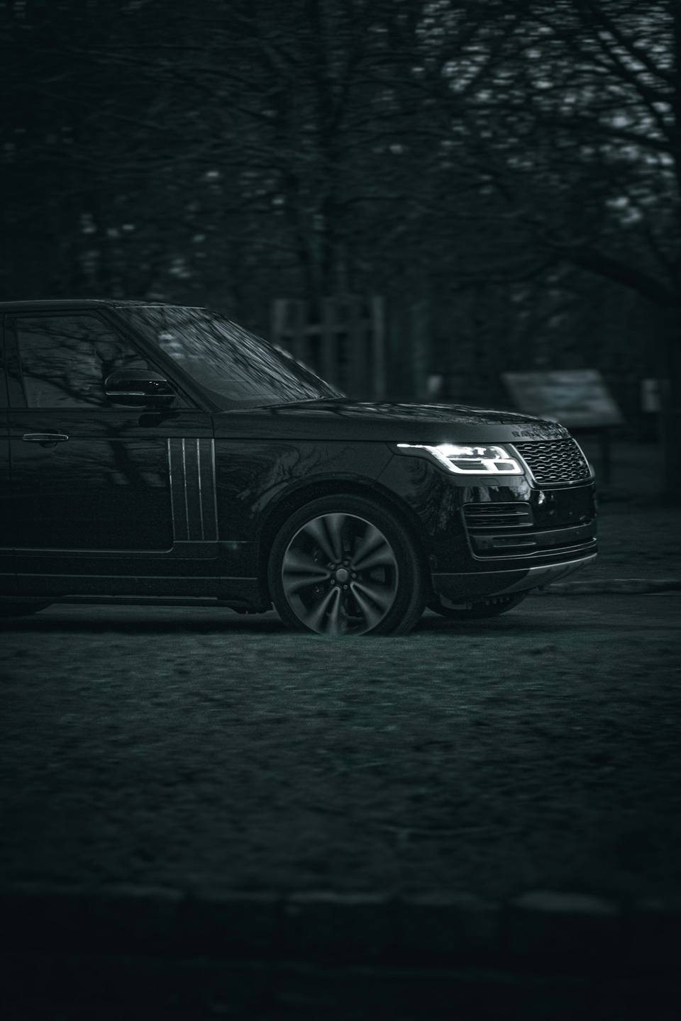Discreet executive protection vehicle waiting at night